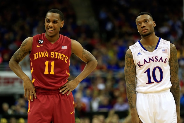 KANSAS CITY, MO - MARCH 14:  Monte Morris #11 of the Iowa State Cyclones smiles as he stands next to a dejected Naadir Tharpe #10 of the Kansas Jayhawks during the Big 12 Basketball Tournament semifinal game at Sprint Center on March 14, 2014 in Kansas City, Missouri.  (Photo by Jamie Squire/Getty Images)