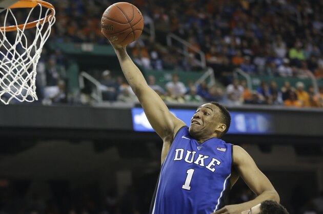 Duke's Jabari Parker (1) drives past Virginia's London Perrantes (23) during the second half of an NCAA college basketball game in the championship of the Atlantic Coast Conference tournament in Greensboro, N.C., Sunday, March 16, 2014. (AP Photo/Gerry Broome)