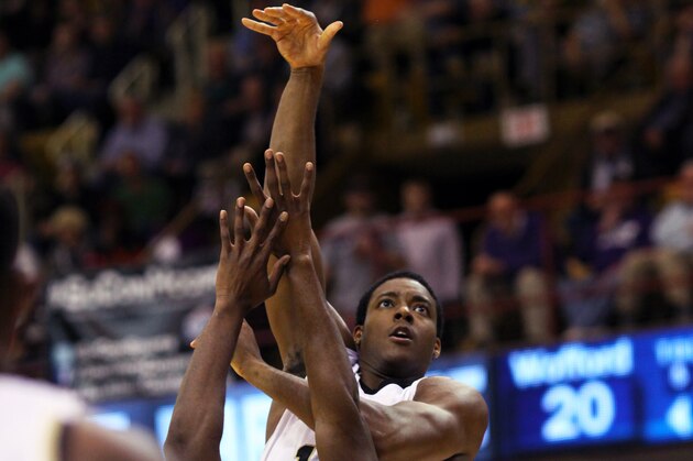 Wofford's Aerris Smith (top) shoots over Western Carolina's Tawaski King (middle) during the first half of the NCAA college basketball championship game of the Southern Conference tournament in Asheville, N.C., Monday, March 10, 2014. (AP Photo/Adam Jennings) Wofford's Aerris Smith (top) shoots over Western Carolina's Tawaski King (middle) during the first half of the NCAA college basketball championship game of the Southern Conference tournament in Asheville, N.C., Monday, March 10, 2014. (AP Photo/Adam Jennings)