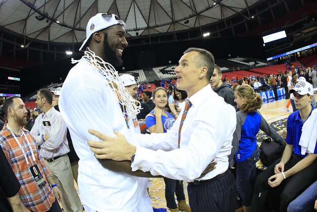 Mar 16, 2014; Atlanta, GA, USA; Florida Gators center Patric Young (4) and head coach Billy Donovan celebrate defeating the Kentucky Wildcats in the championship game for the SEC college basketball tournament at Georgia Dome. Florida won 61-60. Mandatory Credit: Paul Abell-USA TODAY Sports
