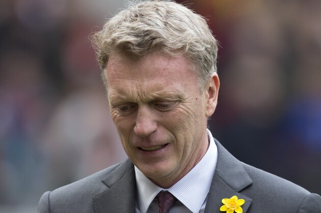 Manchester United's manager David Moyes takes to the touchline before his team's English Premier League soccer match against Liverpool at Old Trafford Stadium, Manchester, England, Sunday March 16, 2014. (AP Photo/Jon Super)