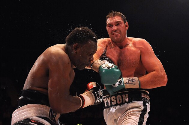 LONDON, ENGLAND - JULY 23: Tyson Fury (R) throws a punch at Dereck Chisora during the British & Commonwealth Heavyweight Title Fight between Dereck Chisora and Tyson Fury at Wembley Arena on July 23, 2011 in London, England. (Photo by Christopher Lee/Getty Images) LONDON, ENGLAND - JULY 23: Tyson Fury (R) throws a punch at Dereck Chisora during the British & Commonwealth Heavyweight Title Fight between Dereck Chisora and Tyson Fury at Wembley Arena on July 23, 2011 in London, England. (Photo by Christopher Lee/Getty Images)