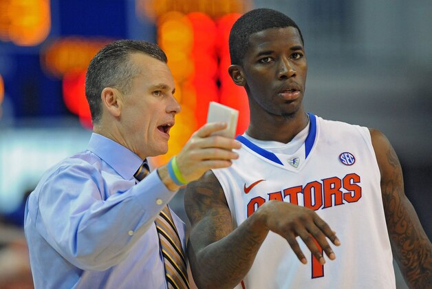Florida coach Billy Donovan, left, talks with Kenny Boynton (1) during the second half of an NCAA college basketball game against North Florida in Gainesville, Fla., Thursday, Nov. 17, 2011. Boynton led the Gators to a 91-55 win over North Florida with a game-high total of 20 points. (AP Photo/ Phil Sandlin)