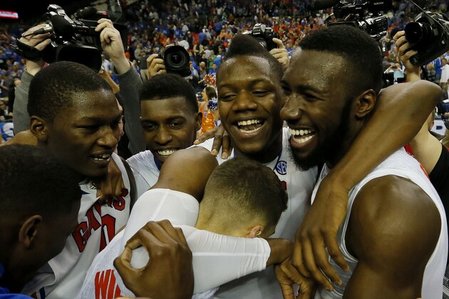 ATLANTA, GA - MARCH 16:  Scottie Wilbekin #5, Will Yeguete #15, Dorian Finney-Smith #10 and Patric Young #4 of the Florida Gators celebrate their 61 to 60 win over the Kentucky Wildcats in the Championship game of the 2014 Men's SEC Basketball Tournament at Georgia Dome on March 16, 2014 in Atlanta, Georgia.  (Photo by Kevin C. Cox/Getty Images)