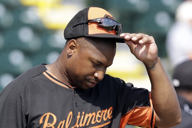 Baltimore Orioles left fielder Delmon Young adjusts his cap during batting practice of a spring training baseball game against the Pittsburgh Pirates in Bradenton, Fla., Monday, March 10, 2014. (AP Photo/Carlos Osorio)