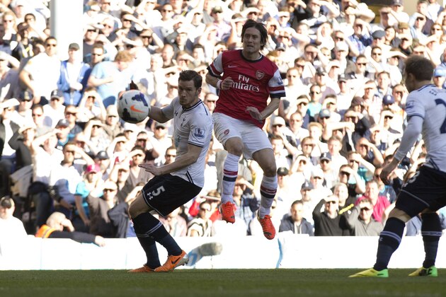 Arsenal's Tomas Rosicky, right, scores past Tottenham Hotspur's Jan Vertonghen during the English Premier League soccer match between Tottenham Hotspur and Arsenal at White Hart Lane stadium in London, Sunday, March 16, 2014. (AP Photo/Matt Dunham) Arsenal's Tomas Rosicky, right, scores past Tottenham Hotspur's Jan Vertonghen during the English Premier League soccer match between Tottenham Hotspur and Arsenal at White Hart Lane stadium in London, Sunday, March 16, 2014. (AP Photo/Matt Dunham)
