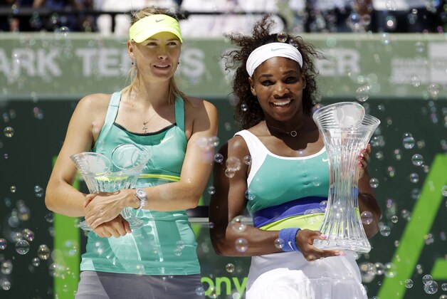Serena Williams, right, and Maria Sharapova, of Russia, pose with their trophies after the final match at the Sony Open tennis tournament, in Key Biscayne, Fla., Saturday, March 30, 2013. Williams won 4-6, 6-3, 6-0. (AP Photo/Alan Diaz)