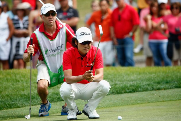 PALM HARBOR, FL - MARCH 16:  Kevin Na assesses a putt on the 4th green during the final round of the Valspar Championship at Innisbrook Resort and Golf Club on March 16, 2014 in Palm Harbor, Florida.  (Photo by Sam Greenwood/Getty Images)