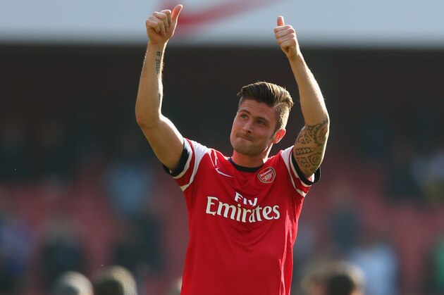 LONDON, ENGLAND - MARCH 08:  Olivier Giroud of Arsenal applauds the crowd at the end of the FA Cup Quarter-Final match between Arsenal and Everton at Emirates Stadium on March 8, 2014 in London, England.  (Photo by Paul Gilham/Getty Images)