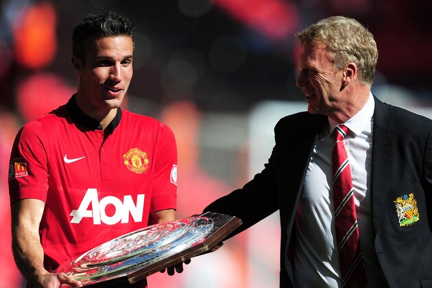 LONDON, ENGLAND - AUGUST 11:  Robin van Persie of Manchester United and manager David Moyes with the trophy after victory in the FA Community Shield match between Manchester United and Wigan Athletic at Wembley Stadium on August 11, 2013 in London, England.  (Photo by Jamie McDonald/Getty Images)