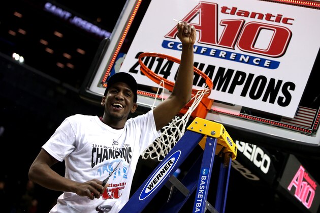 NEW YORK, NY - MARCH 16:  Langston Galloway #10 of the Saint Joseph's Hawks cuts down the net after defeating the Virginia Commonwealth Rams during the Championship game of the 2014 Atlantic 10 Men's Basketball Tournament at Barclays Center on March 16, 2014 in the Brooklyn borough of New York City. The Hawks beat the Rams 65-61.  (Photo by Mike Lawrie/Getty Images)
