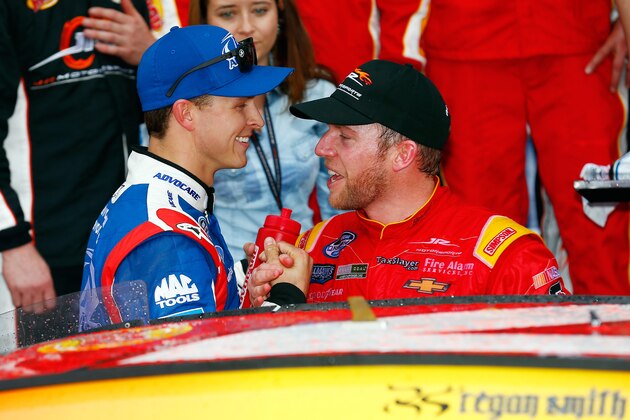 DAYTONA BEACH, FL - FEBRUARY 22: Regan Smith, driver of the #7 Ragu Chevrolet, is congratulated by Trevor Bayne, driver of the #6 Advocare Ford, in Victory Lane after winning the NASCAR Nationwide Series DRIVE4COPD 300 at Daytona International Speedway on February 22, 2014 in Daytona Beach, Florida.  (Photo by Tom Pennington/Getty Images)