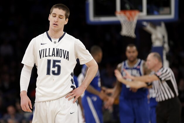 Villanova's Ryan Arcidiacono, left, reacts after his team committed a foul during the second half of an NCAA college basketball game against Seton Hall in the second round of the Big East Conference tournament at Madison Square Garden, Thursday, March 13, 2014 in New York. Seton Hall defeated Villanova 64-63.(AP Photo/Seth Wenig)