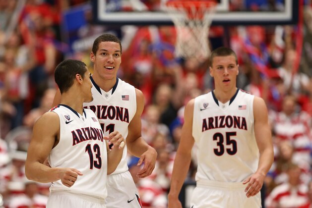 TUCSON, AZ - FEBRUARY 26:  (L-R) Nick Johnson #13, Aaron Gordon #11 and Kaleb Tarczewski #35 of the Arizona Wildcats react after scoring against the California Golden Bears during the second half of the college basketball game at McKale Center on February 26, 2014 in Tucson, Arizona. The Wildcats defeated the Golden Bears 87-59.  (Photo by Christian Petersen/Getty Images)