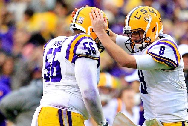 BATON ROUGE, LA - NOVEMBER 23:  Quarterback Zach Mettenberger #8 of the LSU Tigers celebrates with offensive guard Trai Turner #56 after passing for a  touchdown against the Texas A&M Aggies at Tiger Stadium on November 23, 2013 in Baton Rouge, Louisiana.  (Photo by Sean Gardner/Getty Images)