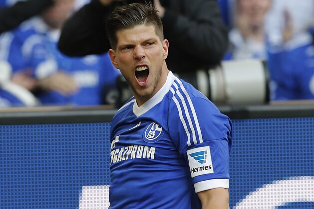 Schalke's Klaas-Jan Huntelaar of the Netherlands celebrates after scoring  during the German first division Bundesliga soccer match between Schalke 04 and 1899 Hoffenheim in Gelsenkirchen, Germany, Saturday, March 8, 2014. (AP Photo/Frank Augstein)