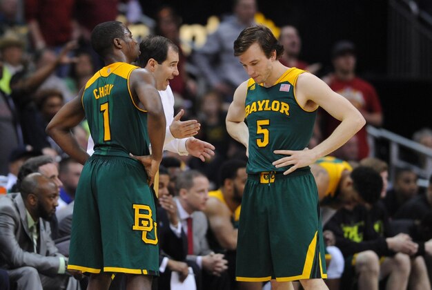 Mar 15, 2014; Kansas City, MO, USA; Baylor Bears head coach Scott Drew talks with guard Kenny Chery (1) and guard Brady Heslip (5) during the second half against the Iowa State Cyclones in the championship game of the Big 12 Conference college basketball tournament at Sprint Center. Iowa State won 74 - 65. Mandatory Credit: Denny Medley-USA TODAY Sports