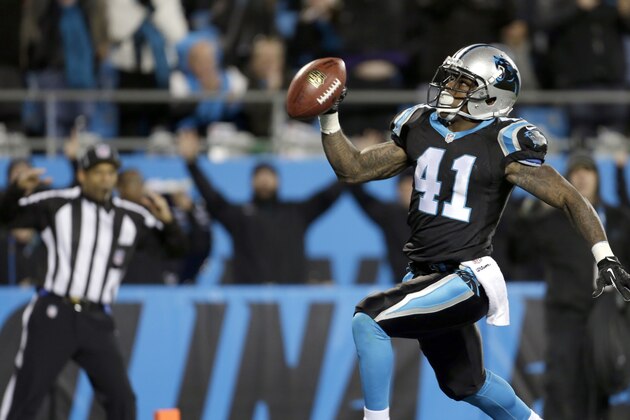 Carolina Panthers' Captain Munnerlyn (41) looks to the end zone crowd as he runs his interception against the New York Jets into the end zone during the second half of an NFL football game in Charlotte, N.C., Sunday, Dec. 15, 2013. The Panthers won 30-20. (AP Photo/Bob Leverone)