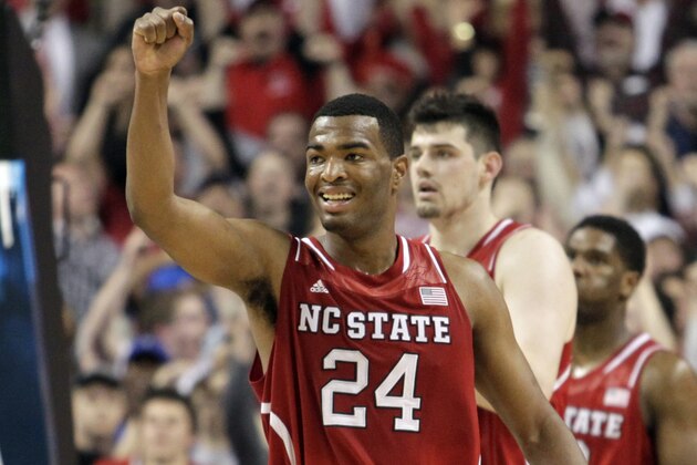 North Carolina State's T.J. Warren (24) celebrates during the second half of a quarterfinal NCAA college basketball game against Syracuse at the Atlantic Coast Conference tournament in Greensboro, N.C., Friday, March 14, 2014. North Carolina State won 66-63. (AP Photo/Bob Leverone)