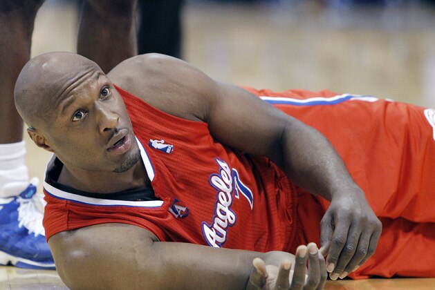 FILE - In this March 26, 2013, file photo, Los Angeles Clippers' Lamar Odom looks on from the court during an NBA basketball game in Dallas. Odom has been charged Friday, Sept. 13, 2013, with a misdemeanour count of driving under the influence, nearly two weeks after his Mercedes-Benz was pulled over on a Southern California freeway. The Los Angeles city attorney's office said that the charges stem from Odom's Aug. 30 arrest in the San Fernando Valley. (AP Photo/Brandon Wade, File)