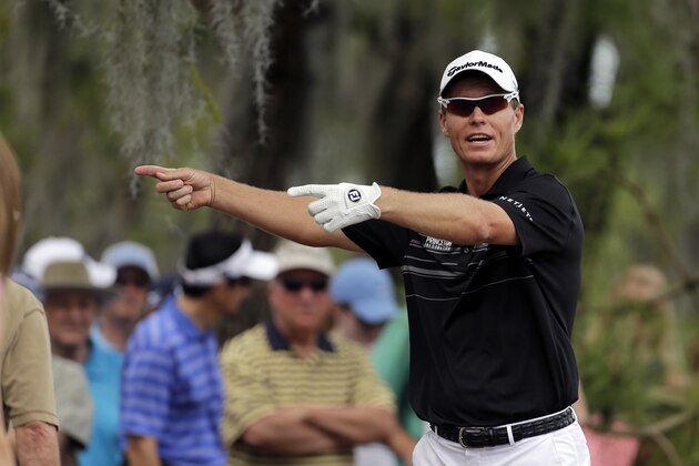 John Senden, of Australia, moves the gallery back on the seventh hole during the final round of the Valspar Championship golf tournament at Innisbrook Sunday, March 16, 2014, in Palm Harbor, Fla. (AP Photo/Chris O'Meara)
