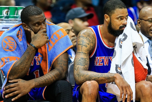 Feb 22, 2014; Atlanta, GA, USA; New York Knicks power forward Amar'e Stoudemire (1) an center Tyson Chandler (6) react on the bench as the clock winds down in the second half against the Atlanta Hawks at Philips Arena. The Hawks won 107-98. Mandatory Credit: Daniel Shirey-USA TODAY Sports