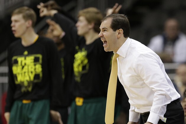 Baylor coach Scott Drew instructs his players during the first half of an NCAA college basketball game against the Texas in the semifinals of the Big 12 Conference tournament on Friday, March 14, 2014, in Kansas City, Mo. (AP Photo/Charlie Riedel)