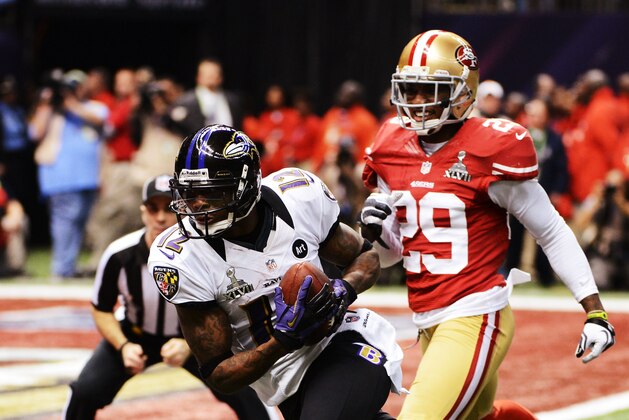 NEW ORLEANS, LA - FEBRUARY 03:  Jacoby Jones #12 of the Baltimore Ravens runs into the endzone to score a 56-yard touchdown in the second quarter against Chris Culliver #29 of the San Francisco 49ers during Super Bowl XLVII at the Mercedes-Benz Superdome on February 3, 2013 in New Orleans, Louisiana.  (Photo by Harry How/Getty Images)