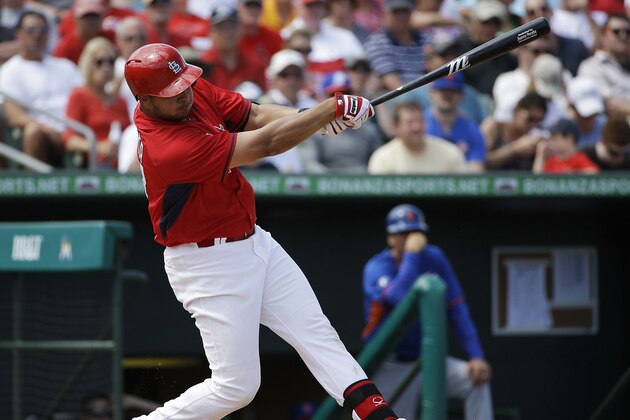 St. Louis Cardinals' Jhonny Peralta singles to score teammate Randal Grichuk in the fifth inning of an exhibition spring training baseball game against the New York Mets, Sunday, March 16, 2014, in Jupiter, Fla. (AP Photo/David Goldman)