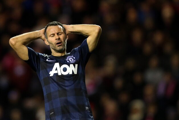 Manchester United's Ryan Giggs holds his head after being defeated by Sunderland at the end of their English League Cup semifinal first leg soccer match at the Stadium of Light, Sunderland, England, Tuesday, Jan. 7, 2014. (AP Photo/Scott Heppell) Manchester United's Ryan Giggs holds his head after being defeated by Sunderland at the end of their English League Cup semifinal first leg soccer match at the Stadium of Light, Sunderland, England, Tuesday, Jan. 7, 2014. (AP Photo/Scott Heppell)