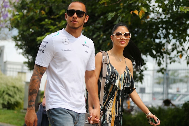 KUALA LUMPUR, MALAYSIA - MARCH 24:  Lewis Hamilton of Great Britain and Mercedes GP and his girlfriend Nicole Scherzinger of the Pussycat Dolls arrive in the paddock before the Malaysian Formula One Grand Prix at the Sepang Circuit on March 24, 2013 in Kuala Lumpur, Malaysia.  (Photo by Clive Mason/Getty Images)