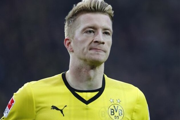 Dortmund's Marco Reus celebrates after scoring  during the German first division Bundesliga soccer match between Borussia Dortmund and Hertha BSC Berlin in Dortmund , Germany, Saturday, Dec. 21, 2013. (AP Photo/Frank Augstein)