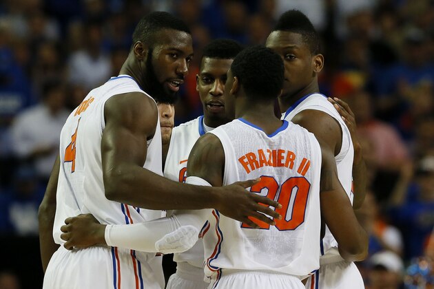 ATLANTA, GA - MARCH 16:  Casey Prather #24, Scottie Wilbekin #5, Will Yeguete #15, Michael Frazier II #20 and Patric Young #4 of the Florida Gators hullde in the first half against the Kentucky Wildcats during the Championship game of the 2014 Men's SEC Basketball Tournament at Georgia Dome on March 16, 2014 in Atlanta, Georgia.  (Photo by Kevin C. Cox/Getty Images)