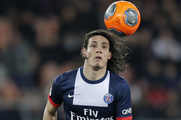 Paris Saint Germain's Edinson Cavani of Uruguay looks at the ball during their French League One soccer match against Marseille, at the Parc des Princes stadium, in Paris, Sunday, March 2 , 2014. (AP Photo/Lionel Cironneau)