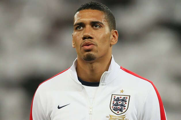 England's Chris Smalling waits for the national anthems to begin during the international friendly soccer match between England and Denmark at Wembley stadium in London Wednesday, March  5,  2014. (AP Photo/Alastair Grant)