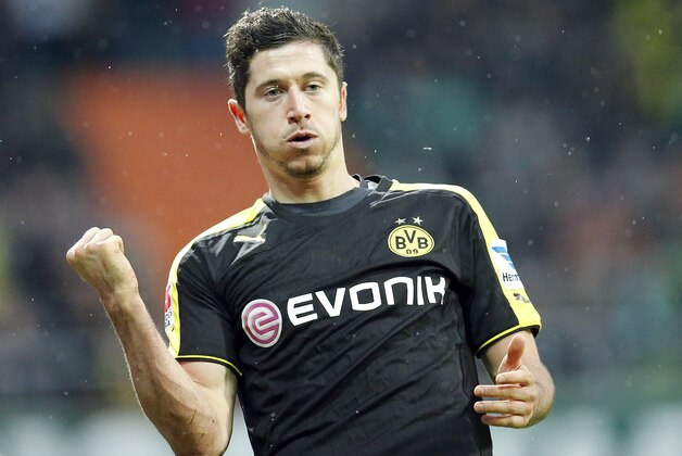 Dortmund's Robert Lewandowski of Poland celebrates after scoring during the German first division Bundesliga soccer match between Werder Bremen and Borussia Dortmund in Bremen, Germany, Saturday, Feb. 8, 2014. (AP Photo/Frank Augstein)