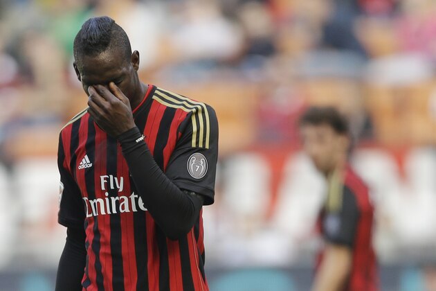 AC Milan forward Mario Balotelli touches his eyes during a Serie A soccer match between AC Milan and Parma, at the San Siro stadium in Milan, Italy, Sunday, March 16, 2014. Parma won 4-2. (AP Photo/Luca Bruno)