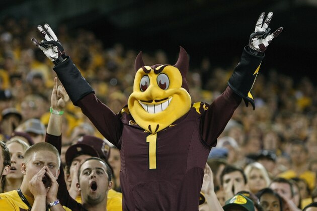 TEMPE, AZ - NOVEMBER 16: Team mascot Sparky of the Arizona State Sun Devils leads the student section in cheer during the third quarter of their college football game against the Oregon State Beavers at Sun Devil Stadium on November 16, 2013 in Tempe, Arizona.  (Photo by Ralph Freso/Getty Images)
