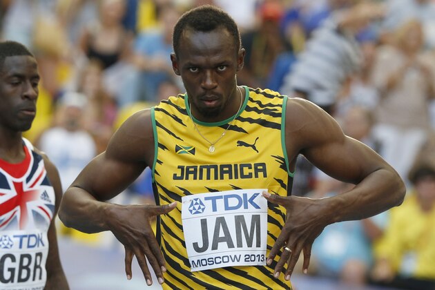 Jamaica's Usain Bolt is introduced before the men's 4x100-meter relay final at the World Athletics Championships in the Luzhniki stadium in Moscow, Russia, Sunday, Aug. 18, 2013. (AP Photo/Matt Dunham)