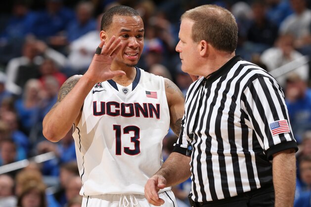 MEMPHIS, TN - MARCH 13: Shabazz Napier #13 of the Connecticut Huskies looks talks with an official against the Memphis Tigers during the quarterfinal round of the American Athletic Conference Tournament at FedExForum on March 13, 2014 in Memphis, Tennessee. Connecticut defeated Memphis 72-53. (Photo by Joe Murphy/Getty Images)