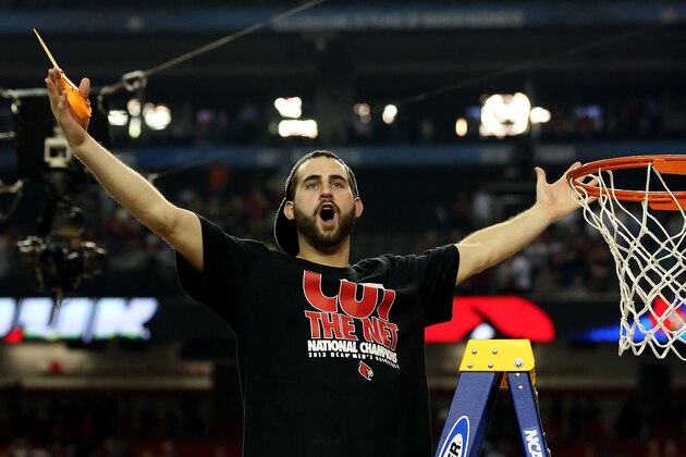 ATLANTA, GA - APRIL 08: Luke Hancock #11 of the Louisville Cardinals celebrates as he cuts down the net after they won 82-76 against the Michigan Wolverines during the 2013 NCAA Men's Final Four Championship at the Georgia Dome on April 8, 2013 in Atlanta, Georgia. (Photo by Streeter Lecka/Getty Images) ATLANTA, GA - APRIL 08: Luke Hancock #11 of the Louisville Cardinals celebrates as he cuts down the net after they won 82-76 against the Michigan Wolverines during the 2013 NCAA Men's Final Four Championship at the Georgia Dome on April 8, 2013 in Atlanta, Georgia. (Photo by Streeter Lecka/Getty Images)