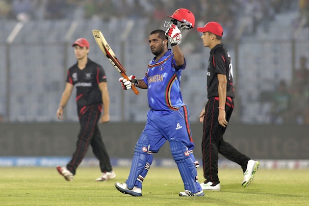 Afghanistan batsman Mohammad Shahzad acknowledges the crowd after scoring fifty runs during their ICC Twenty20 Cricket World Cup match against Hong Kong in Chittagong, Bangladesh, Tuesday, March 18, 2014 . (AP Photo/Bikas Das)