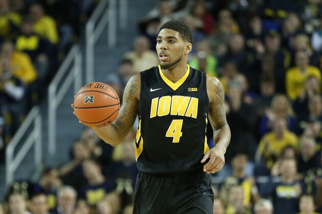 ANN ARBOR, MI - JANUARY 22: Roy Devyn Marble #4 of the Iowa Hawkeyes brings the ball up the court during the second half of the game against the Michigan Wolverines at Crisler Arena on January 22, 2014 in Ann Arbor, Michigan. The Wolverines defeated the Hawkeyes 75-67. (Photo by Leon Halip/Getty Images)