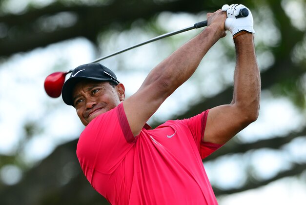 Mar 9, 2014; Miami, FL, USA; Tiger Woods tees off from the 5th hole during the final round of the WGC - Cadillac Championship golf tournament at TPC Blue Monster at Trump National Doral. Mandatory Credit: Andrew Weber-USA TODAY Sports