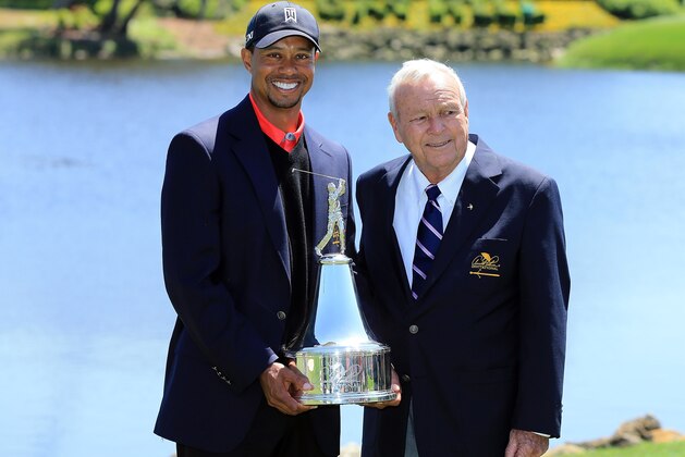 ORLANDO, FL - MARCH 25:  Tiger Woods of the United States is presented with the trophy by Arnold Palmer of the United States, the win meant he re-gained the World's number one position after the final round of the 2013 Arnold Palmer Invitational Presented by Mastercard at Bay Hill Golf and Country Club on March 25, 2013 in Orlando, Florida.  (Photo by David Cannon/Getty Images)