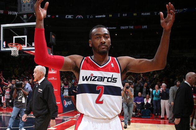 WASHINGTON, DC - FEBRUARY 22: John Wall #2 of the Washington Wizards celebrates the win against the New Orleans Pelicans during the game at the Verizon Center on February 22, 2014 in Washington, DC. NOTE TO USER: User expressly acknowledges and agrees that, by downloading and or using this photograph, User is consenting to the terms and conditions of the Getty Images License Agreement. Mandatory Copyright Notice: Copyright 2014 NBAE (Photo by Ned Dishman/NBAE via Getty Images)