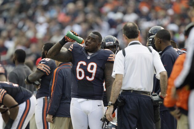 Chicago Bears defensive tackle Henry Melton (69) takes a drink on the sidelines in the first half of an NFL football game against the Seattle Seahawks in Chicago, Sunday, Dec. 2, 2012. (AP Photo/Nam Y. Huh)