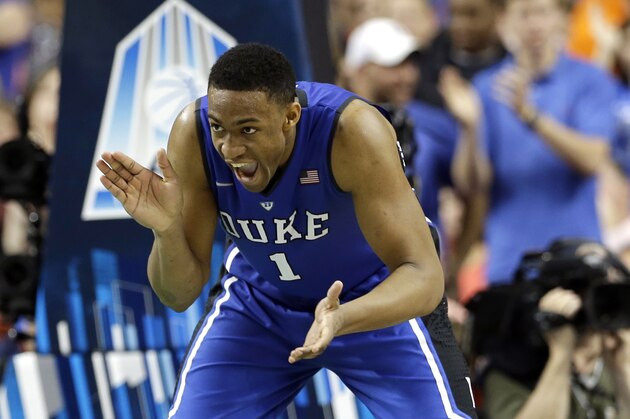Duke's Jabari Parker (1) celebrates after making a basket against Virginia during the second half of an NCAA college basketball game in the championship of the Atlantic Coast Conference tournament in Greensboro, N.C., Sunday, March 16, 2014. (AP Photo/Gerry Broome)