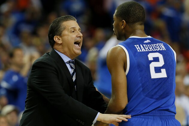 ATLANTA, GA - MARCH 16:  Head coach John Calipari of the Kentucky Wildcats talks to Aaron Harrison #2 in the first half against the Florida Gators during the Championship game of the 2014 Men's SEC Basketball Tournament at Georgia Dome on March 16, 2014 in Atlanta, Georgia.  (Photo by Kevin C. Cox/Getty Images)