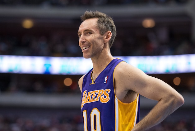 Nov 5, 2013; Dallas, TX, USA; Los Angeles Lakers point guard Steve Nash (10) smiles to the crowd during the first half at the American Airlines Center. Mandatory Credit: Jerome Miron-USA TODAY Sports